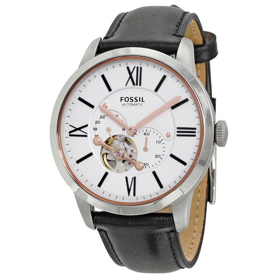 Fossil Townsman white dial watch with Roman numerals, black leather strap, and visible automatic movement