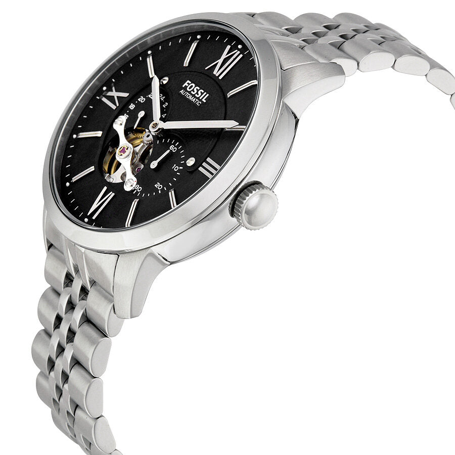 Side angle view of Fossil Townsman watch showing black dial and tapered stainless steel band