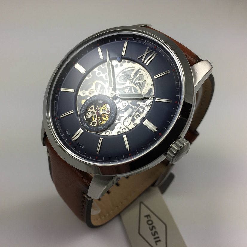 Fossil Townsman ME3154 angled view showing skeleton dial with visible gears and rotor