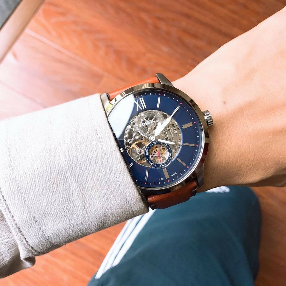 Fossil Townsman ME3154 automatic skeleton watch with brown strap on wrist in sunlight