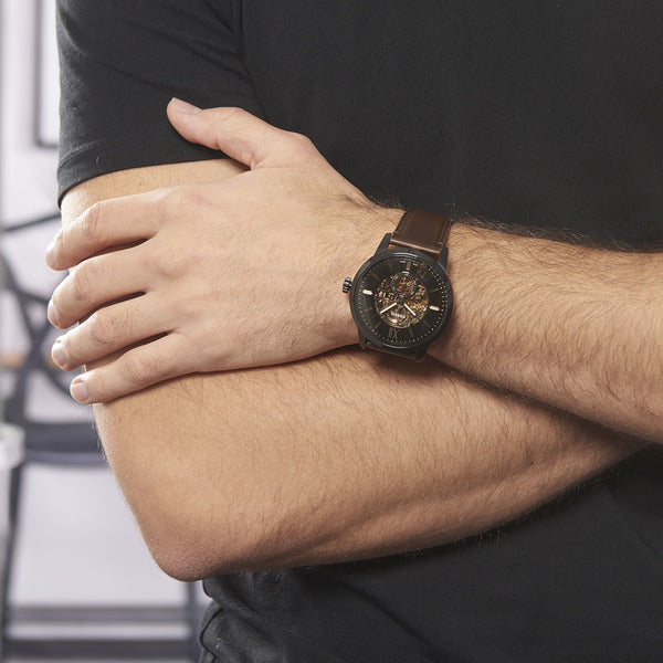 Fossil Townsman ME3155 automatic watch worn on wrist with black skeleton dial visible