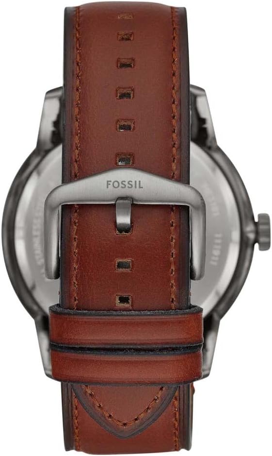 Fossil Townsman watch caseback showing buckle and brown leather strap with stitching