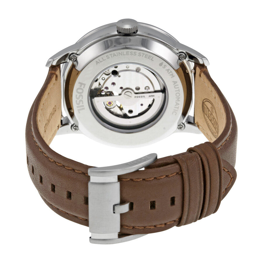 Fossil Townsman watch caseback showing stainless steel with visible mechanical movement and brown leather strap