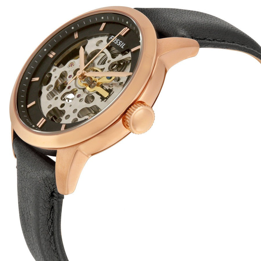 Side angle view of Fossil Townsman skeleton watch showing rose gold case and exposed automatic movement