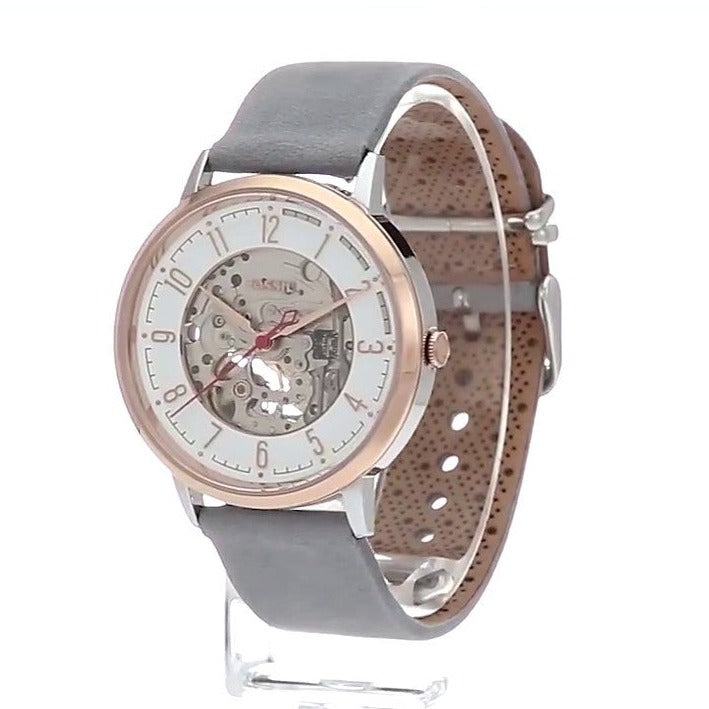 Side view of Fossil Vintage Muse skeleton watch with grey strap