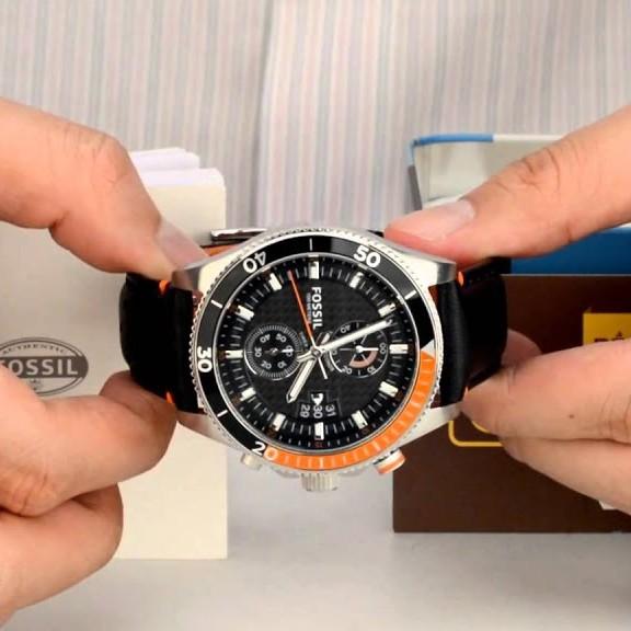 Fossil Wakefield chronograph watch displayed on wrist showing dial and orange strap detail