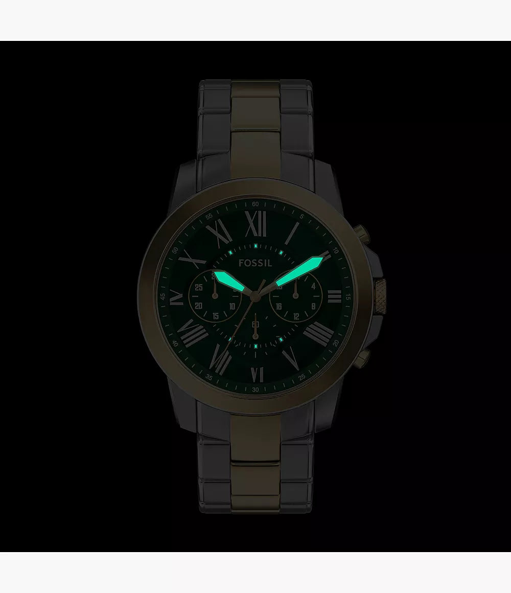 Fossil Grant chronograph with green dial and luminous hands on black background