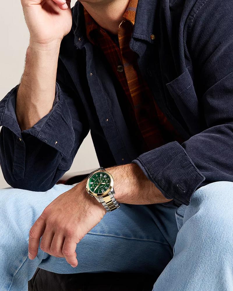 Grant two-tone chronograph watch worn on wrist with green dial visible