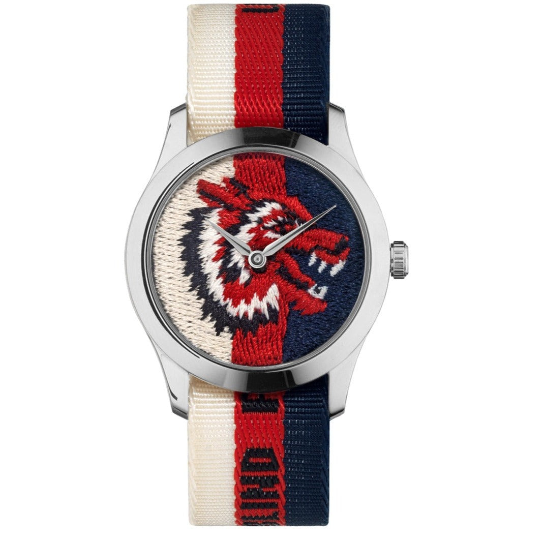 G-Timeless 38mm watch front view with embroidered lion on striped fabric band