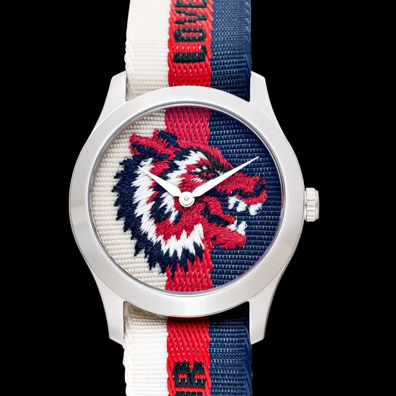 G-Timeless 38mm watch with lion motif on dark background