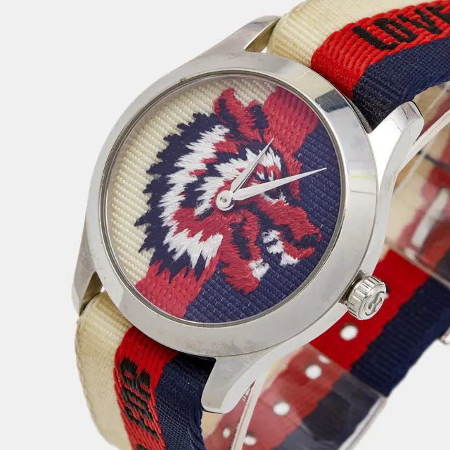 G-Timeless 38mm watch worn on wrist with lion emblem dial visible
