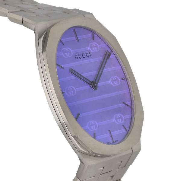 Gucci 25H watch angled view showing blue dial and silver steel strap