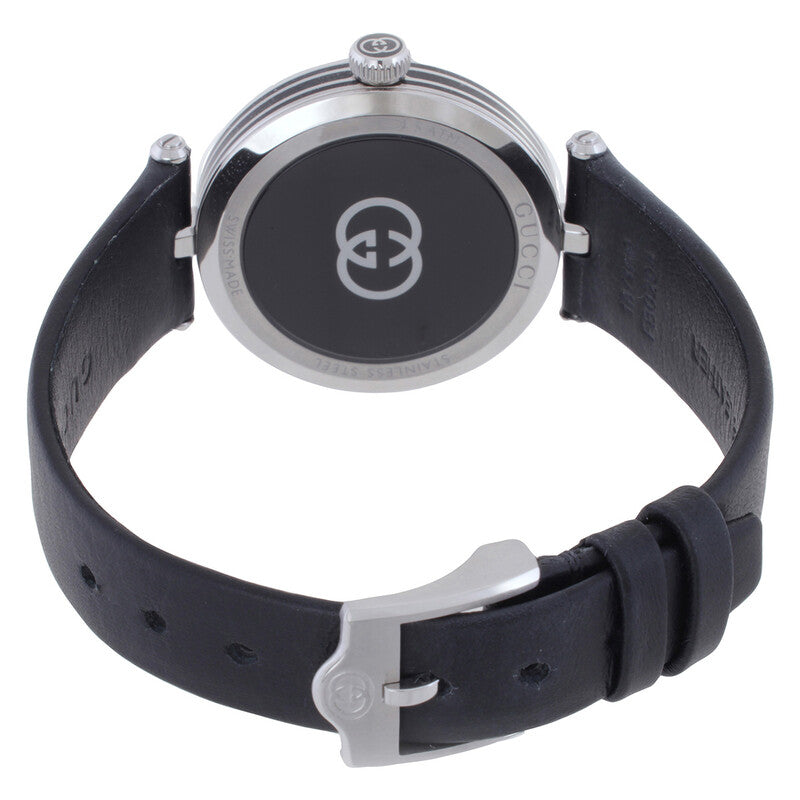 Gucci 25H ladies watch on wrist showing black leather strap and caseback