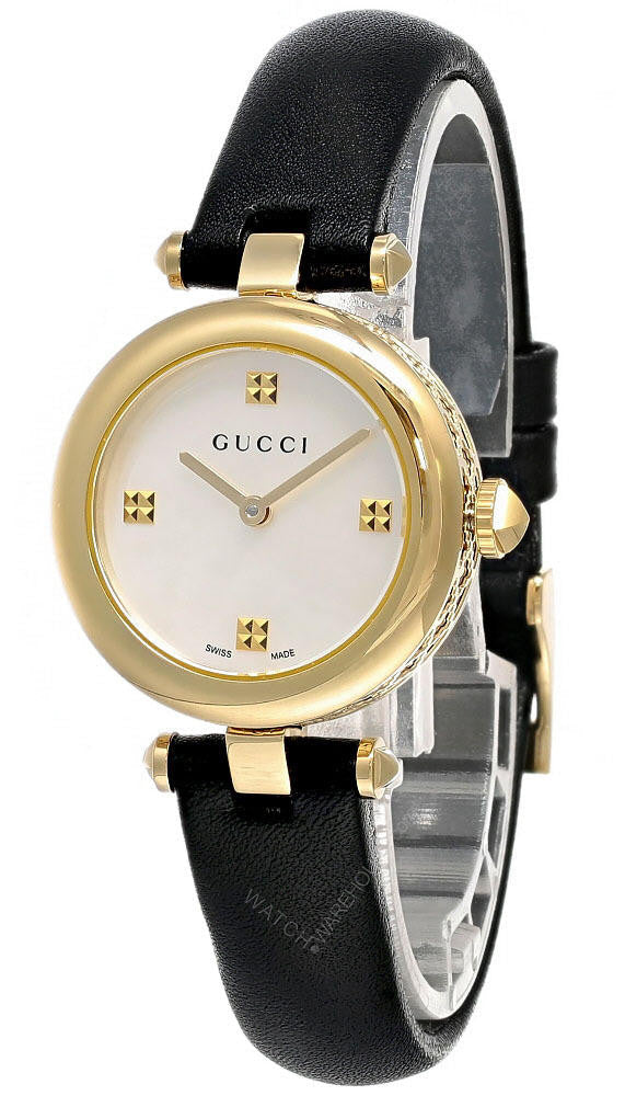 Gucci Diamantissima women's watch angle view showing gold-tone case and black leather strap