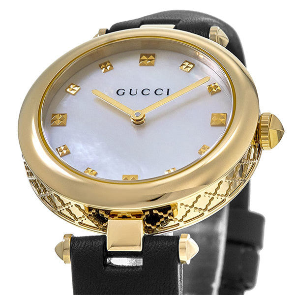 Close-up of Gucci Diamantissima dial with mother-of-pearl surface and diamond hour markers