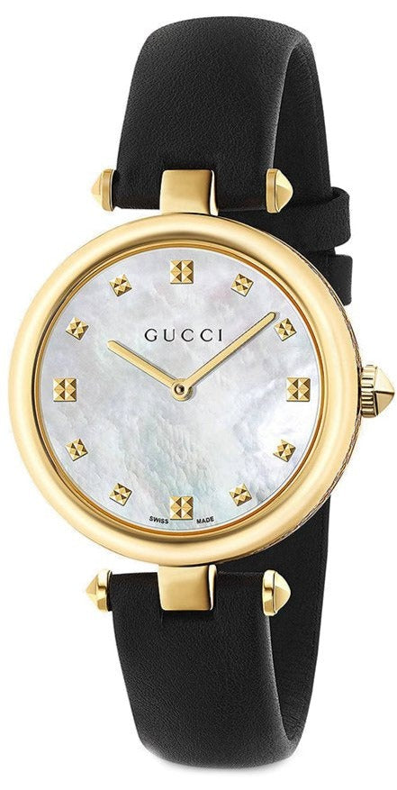 Gucci Diamantissima women's watch with gold-tone case, mother-of-pearl dial, diamond hour markers, and black leather strap