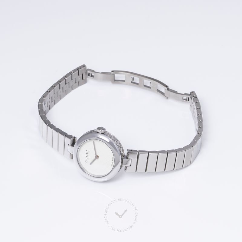 Gucci Diamantissima women's watch on wrist showing stainless steel link bracelet