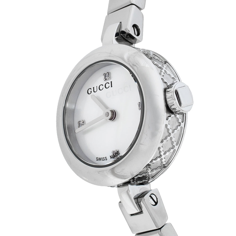 Gucci Diamantissima watch side view showing quilted silver case and white dial