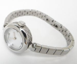 Gucci Diamantissima women's watch on wrist with articulated silver bracelet