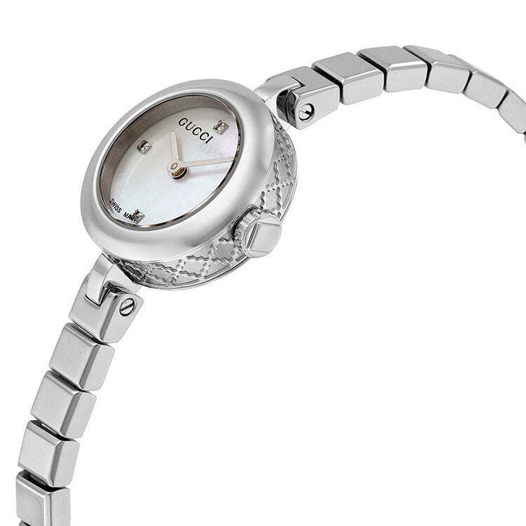 Gucci Diamantissima watch worn on wrist with silver bracelet and white dial