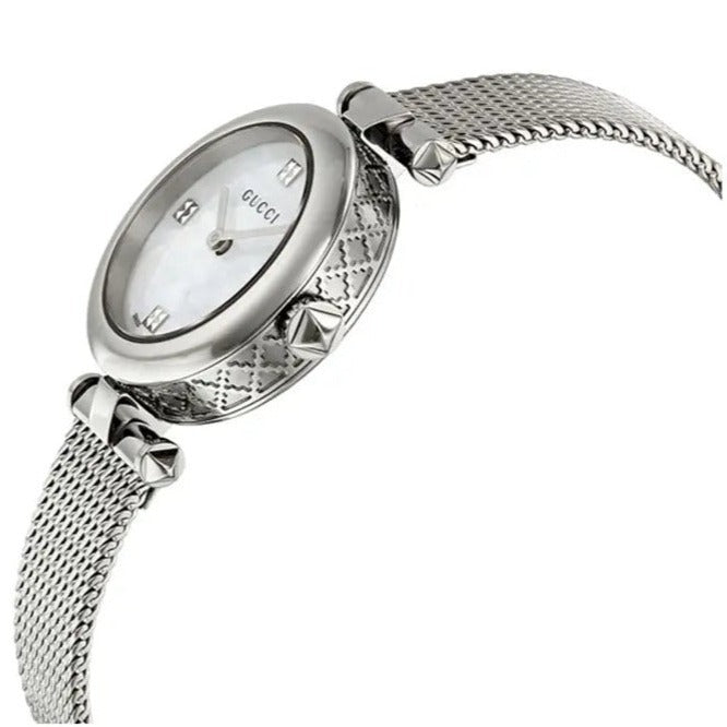 Angled view of Gucci Diamantissima watch showing round case and mesh strap detail