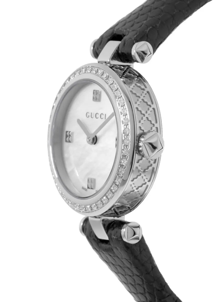 Side angle view of Gucci Diamantissima watch showing diamond bezel and quilted black leather strap