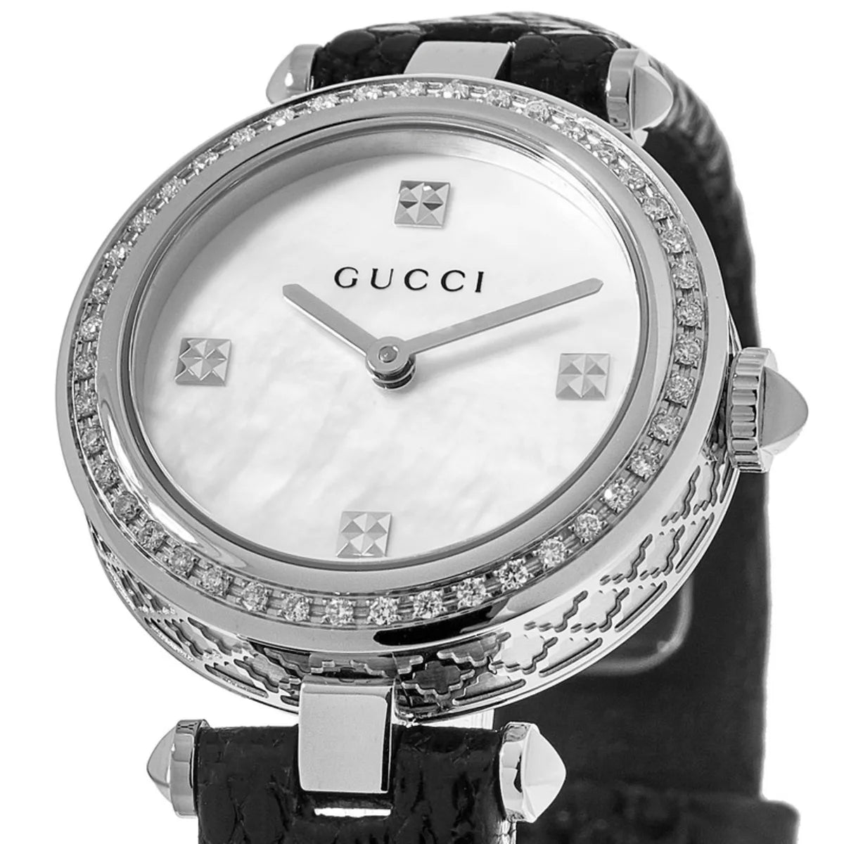 Close-up of Gucci Diamantissima dial with mother-of-pearl finish, diamond hour markers, and diamond bezel setting