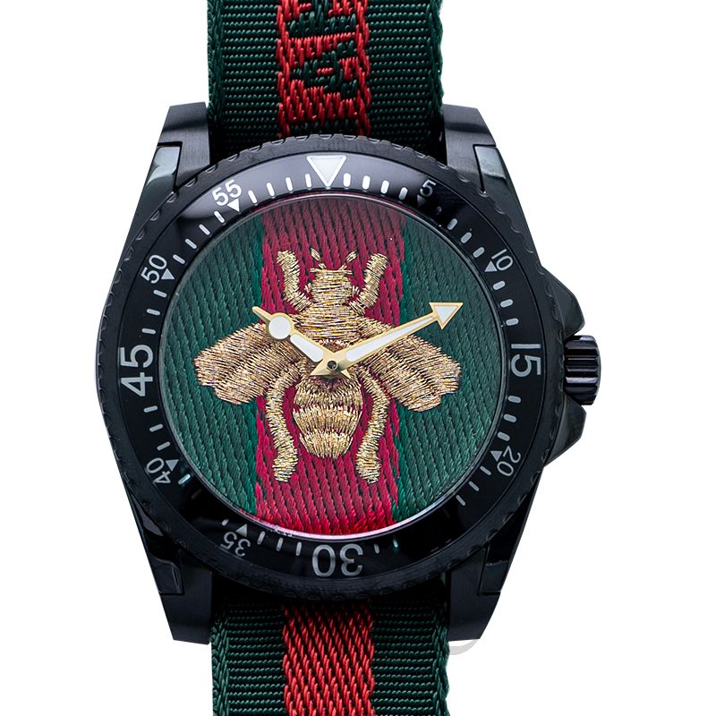 Gucci Dive YA136216 timepiece displaying embroidered gold bee on green and red striped dial with black case