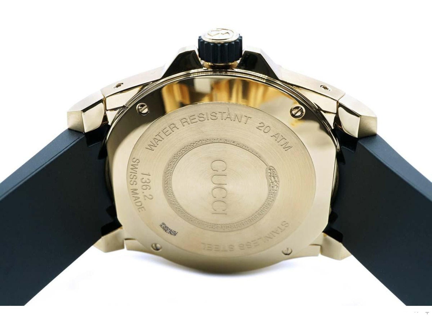 Gucci Dive watch caseback showing gold-plated case, water resistance details, and model information