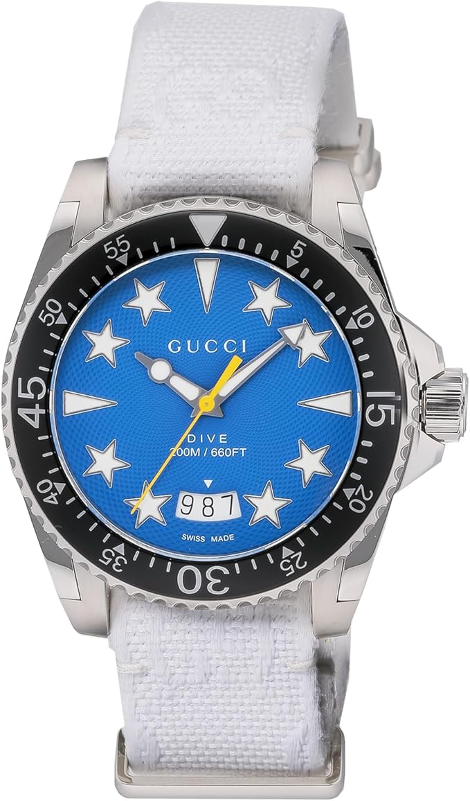 Gucci DIVE watch with blue dial, star hour markers, stainless steel case and white strap