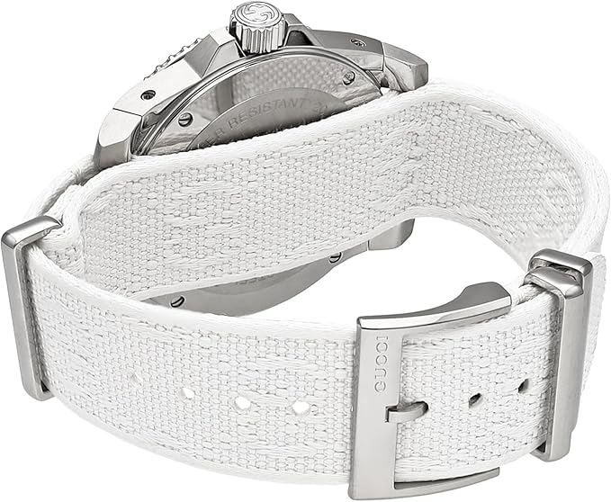 Gucci DIVE watch worn on wrist with white textile strap and stainless steel case