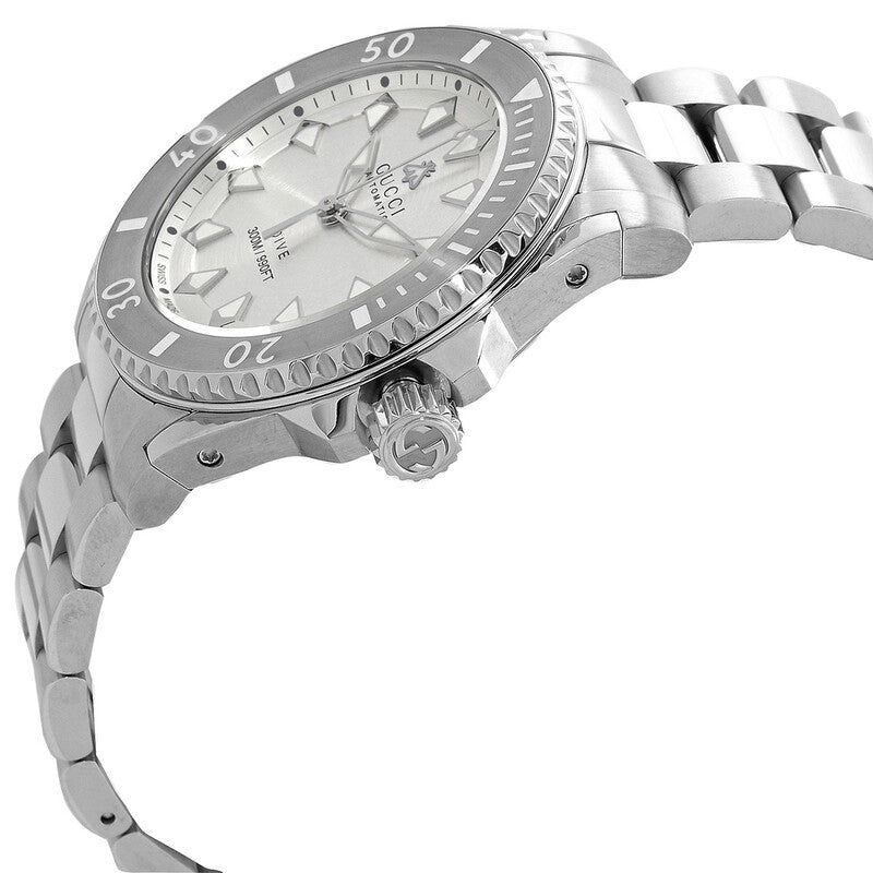 Gucci Dive watch side view showing silver case, bracelet, and crown detail