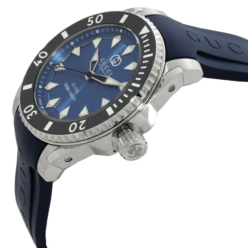 Gucci Dive watch angled view showing steel case, blue dial, and navy rubber strap