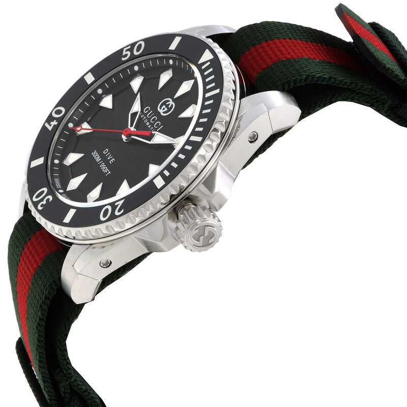 Gucci Dive automatic watch angled view showing stainless steel case and striped strap detail
