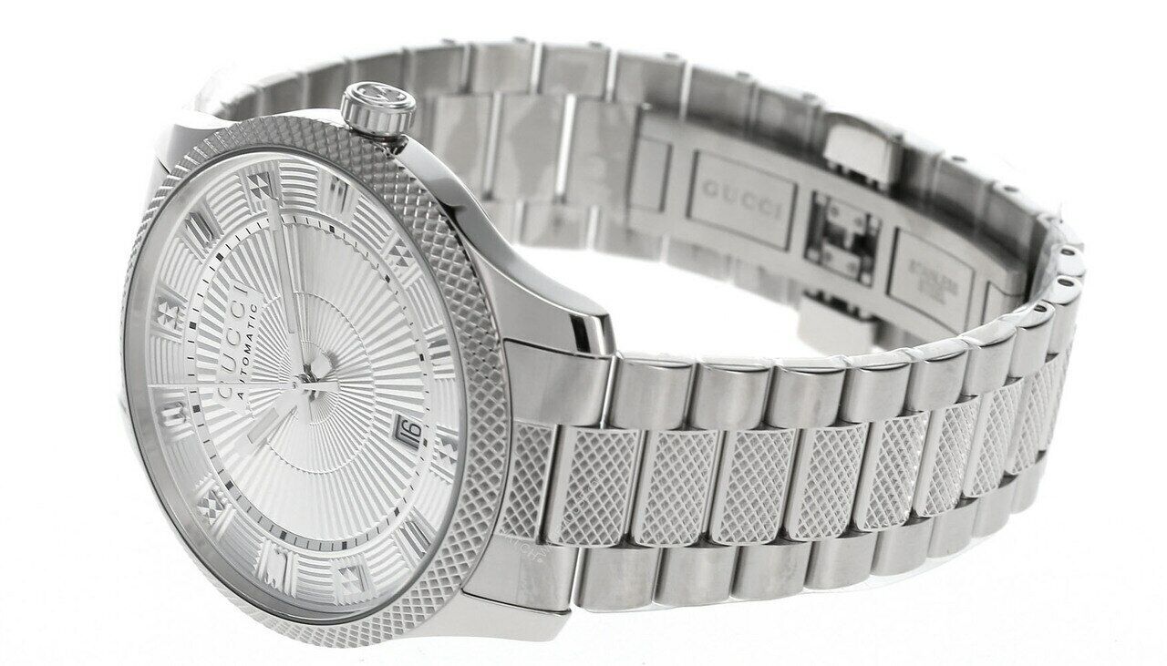 Gucci Eryx watch shown at angle displaying textured steel case and bracelet