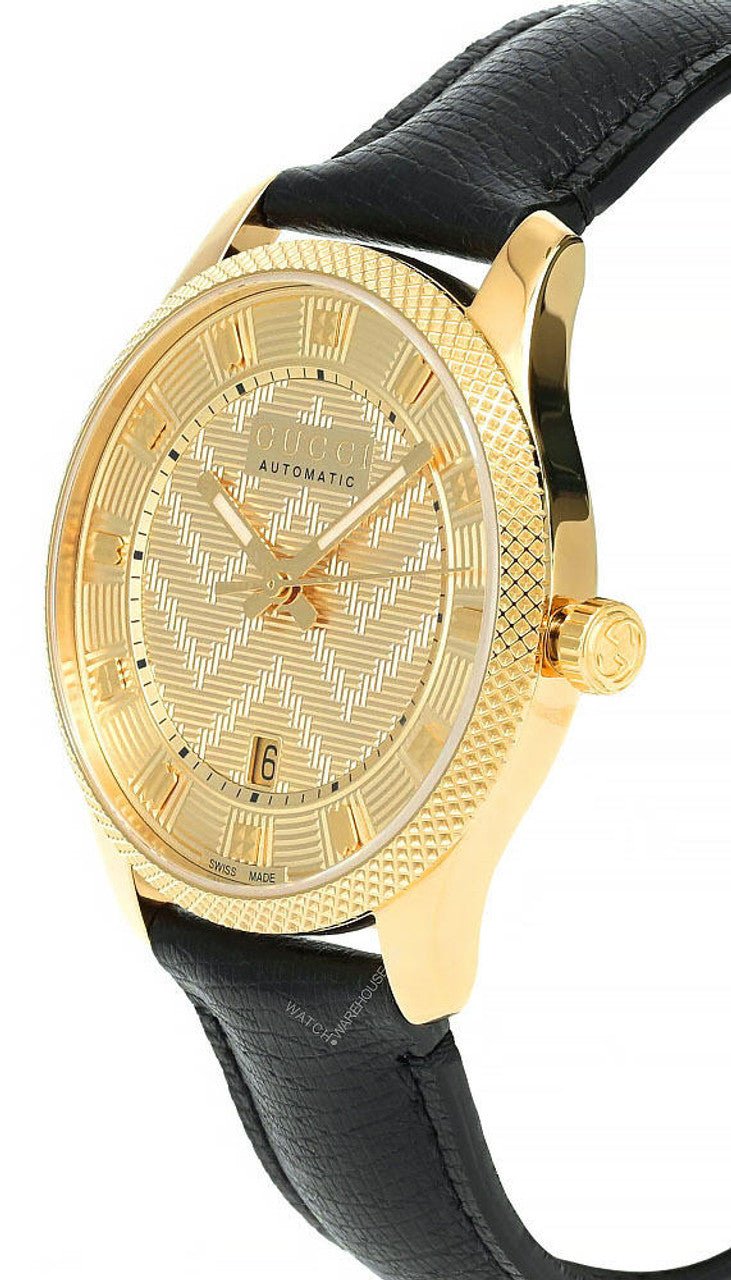 Gucci Eryx watch angled view showing gold case, textured bezel, and black leather strap