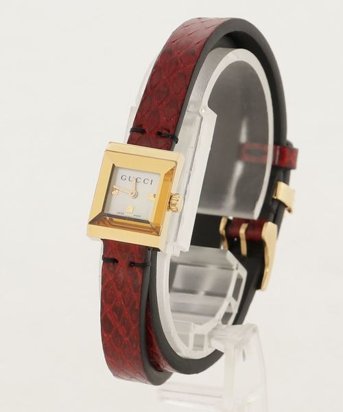 Gucci G-Frame watch side profile showing gold case and red leather strap