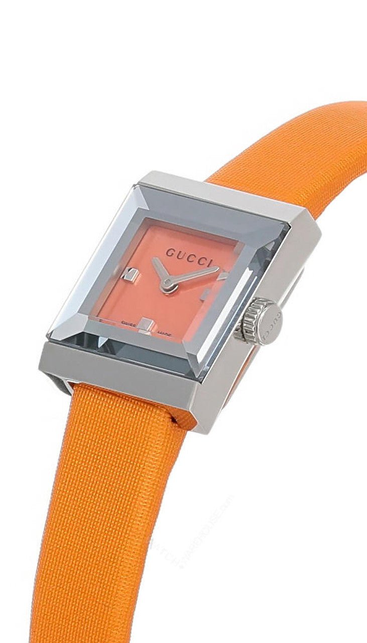 Gucci G-Frame women's watch on wrist showing square stainless steel case and orange strap