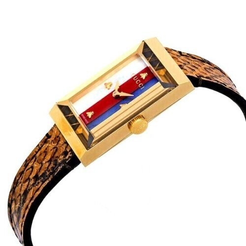 Gucci G-Frame women's watch worn on wrist with brown snakeskin leather strap and gold case