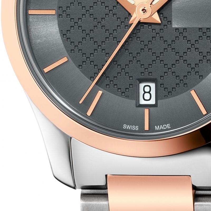 Gucci G-Timeless 27mm dial detail with rose gold bezel and textured face