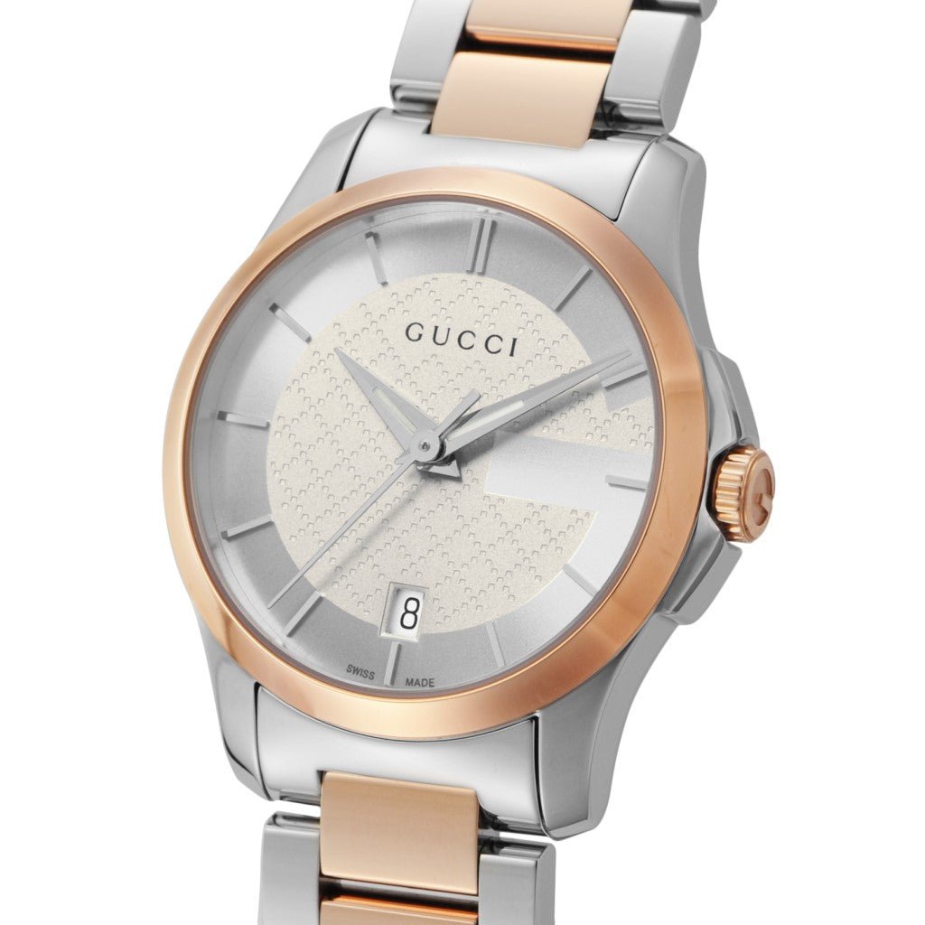Gucci G-Timeless 27mm watch front view with textured silver dial and date display