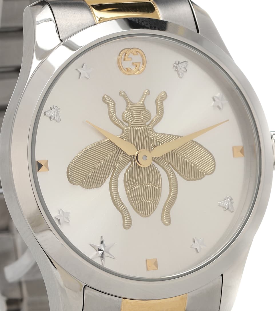 G-Timeless dial detail showing engraved bee, Gucci crest, and gold markers