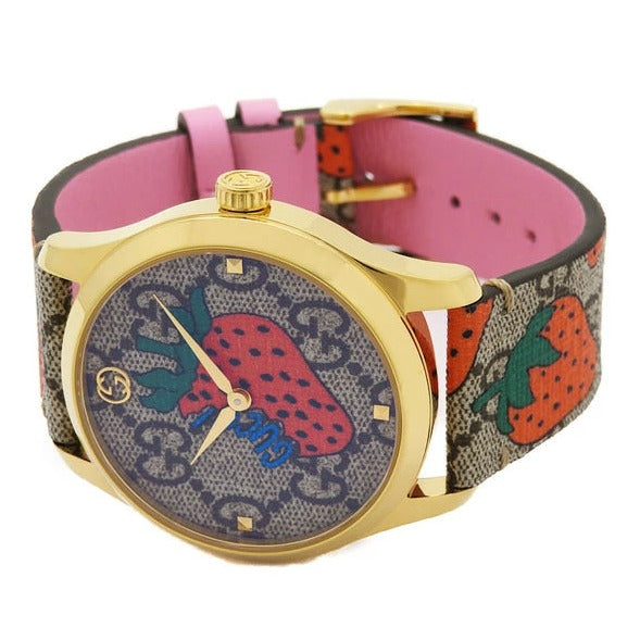 Side profile of Gucci G-Timeless watch showing pink leather strap and case thickness