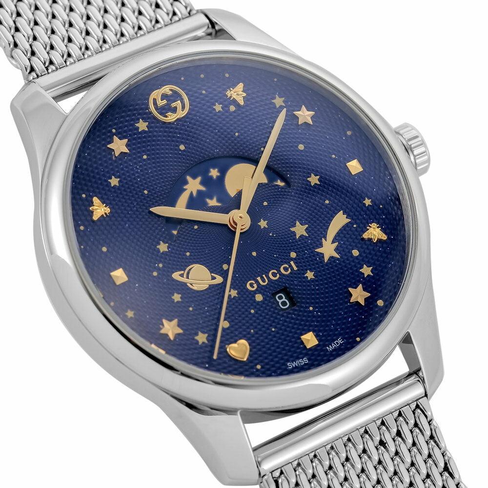 GUCCI G-Timeless moonphase dial detail with gold stars, celestial motifs and moon phase indicator