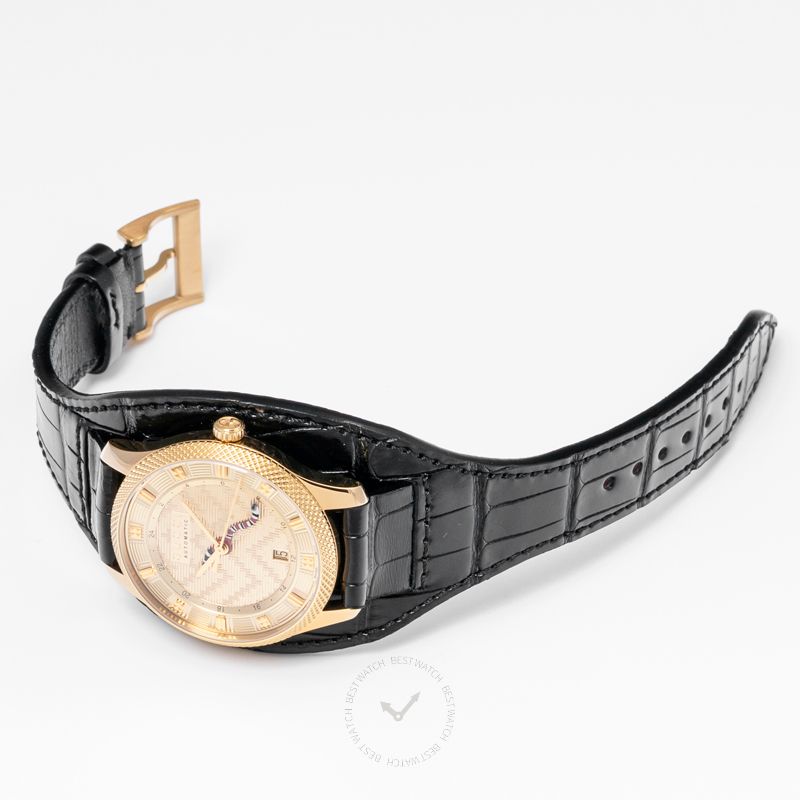 Gucci G-Timeless watch from side angle showing gold-tone case and black crocodile leather strap