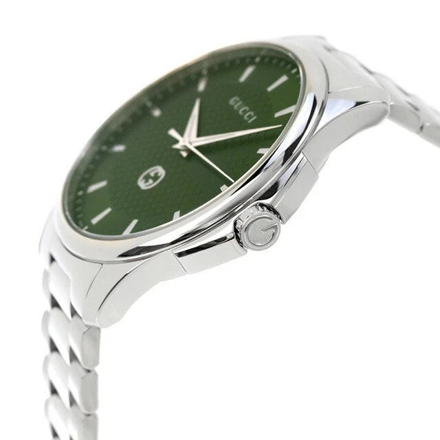 Gucci G-Timeless watch side angle showing green dial, crown, and steel bracelet