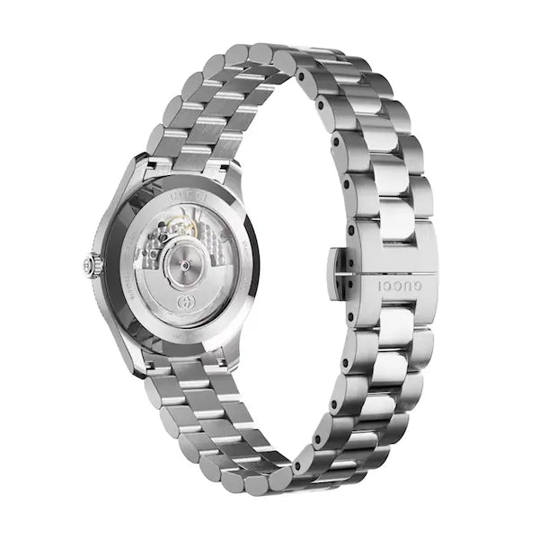 Side profile of Gucci G-Timeless watch showing silver steel case depth and bracelet links
