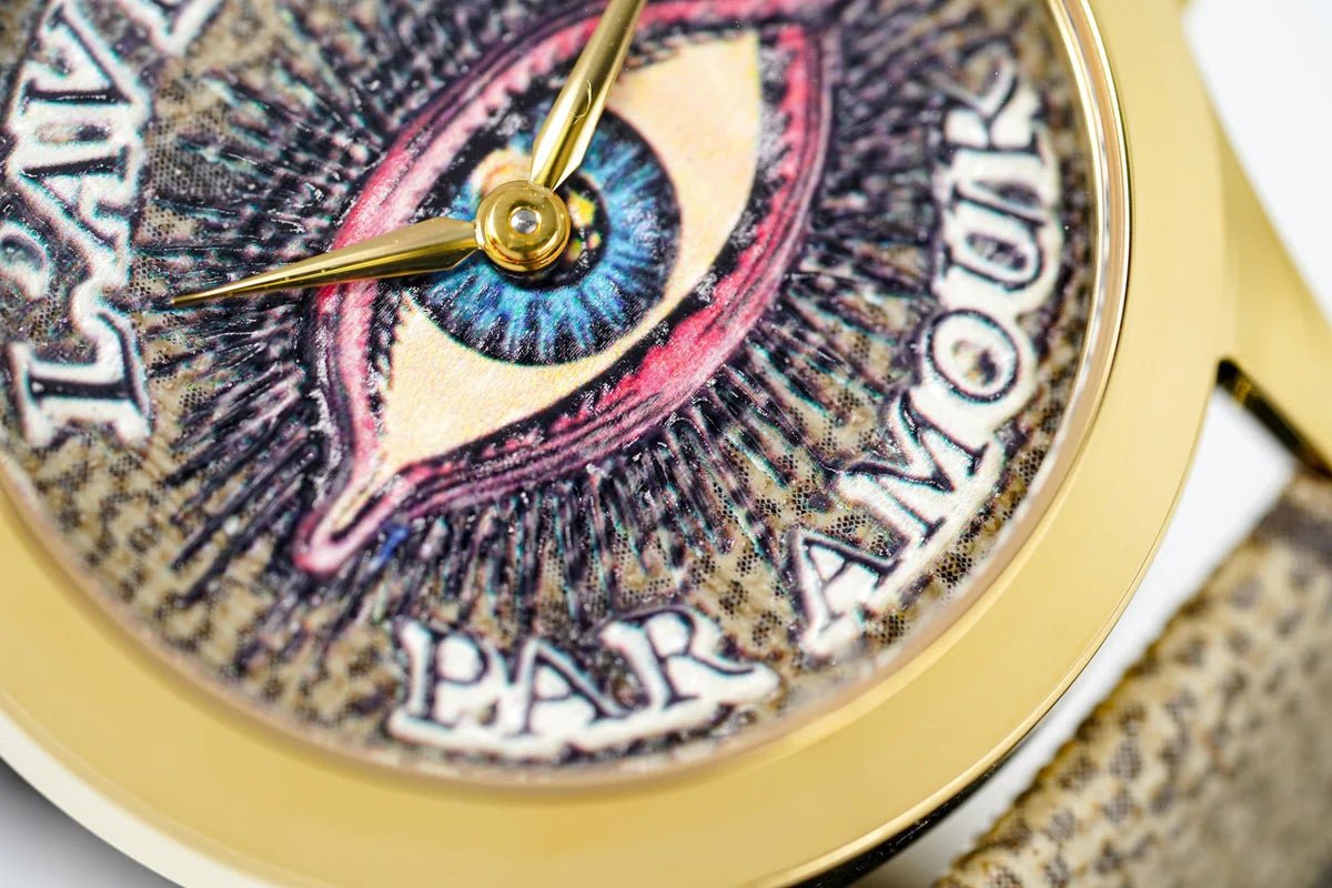 Close-up of Gucci G-Timeless eye motif dial with pink and blue colors