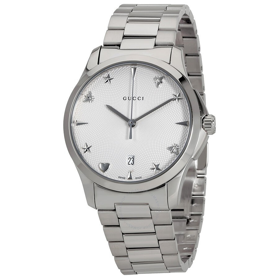 Gucci G-Timeless watch with silver dial, star markers, and stainless steel bracelet