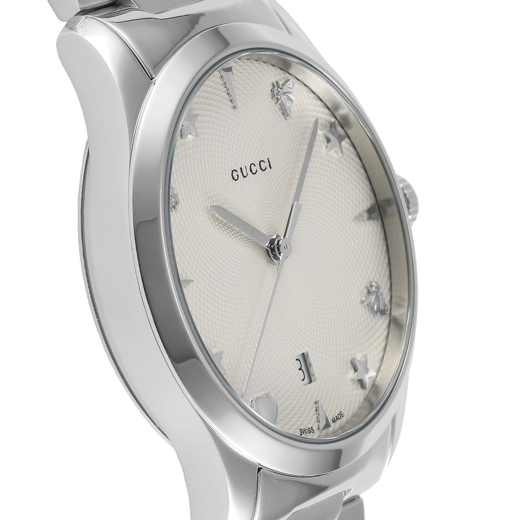 Side angle view of Gucci G-Timeless watch with silver dial and stainless steel case